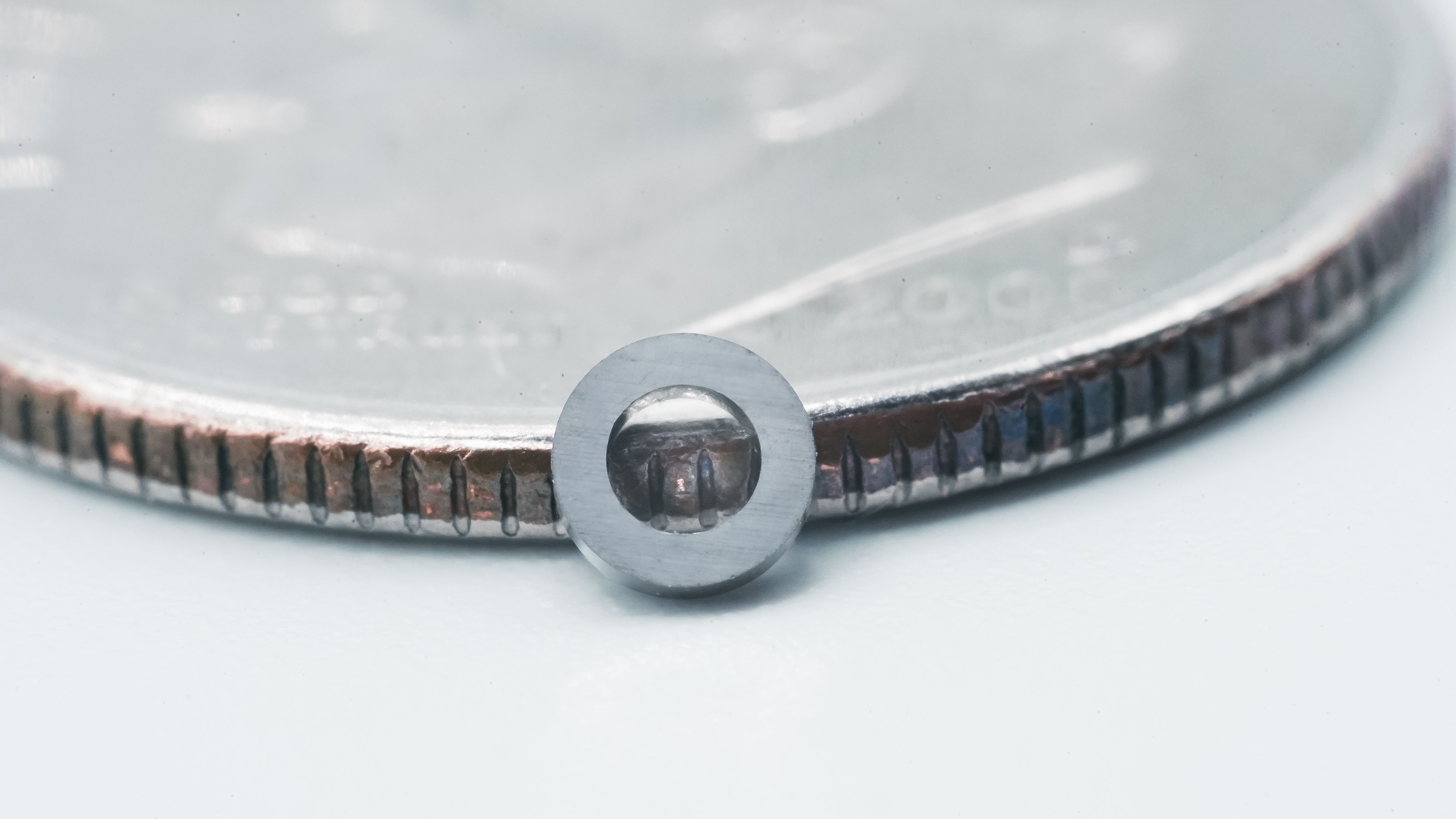 Hyperion Bearing Raceway compared to a coin size.